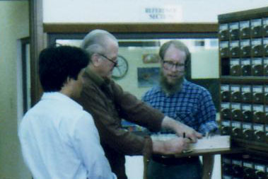 David S Yotsuuye, Tom Kaasa, and Tom Bolling, at the East Asian Library, at 2:25 PM on Monday, 18 June 1984. Tom is locating an expanded edition of Miyamoto Musashi's Gorinsho "The Book of the Five Rings" (Photo Courtesy Tom Bolling)