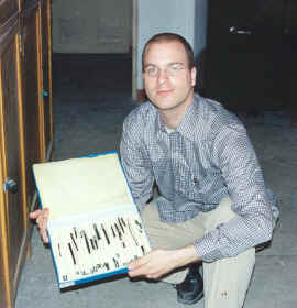 Paul van Els holding one of two cases containing the charcoaled Dingjou Wvndz strips